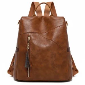 Mochila convertible de eco-cuero Amalfi en color marrón con borla decorativa, vista frontal - Porte Italia.