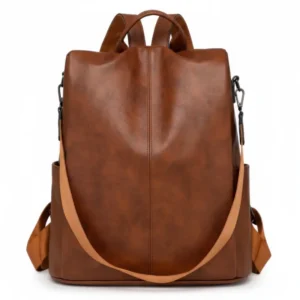 Mochila convertible minimalista de eco-cuero Bologna en color coñac, vista frontal con correa de hombro - Porte Italia.